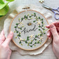 Woman embroidering a bee embroidery pattern