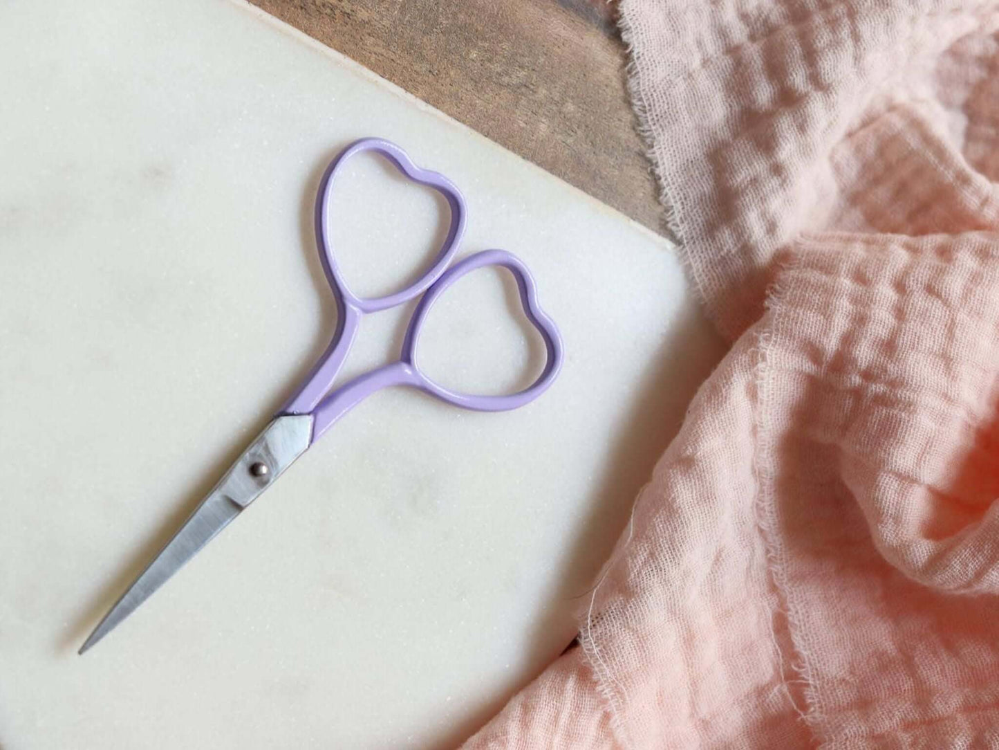 Heart shaped embroidery scissors in a lilac purple color