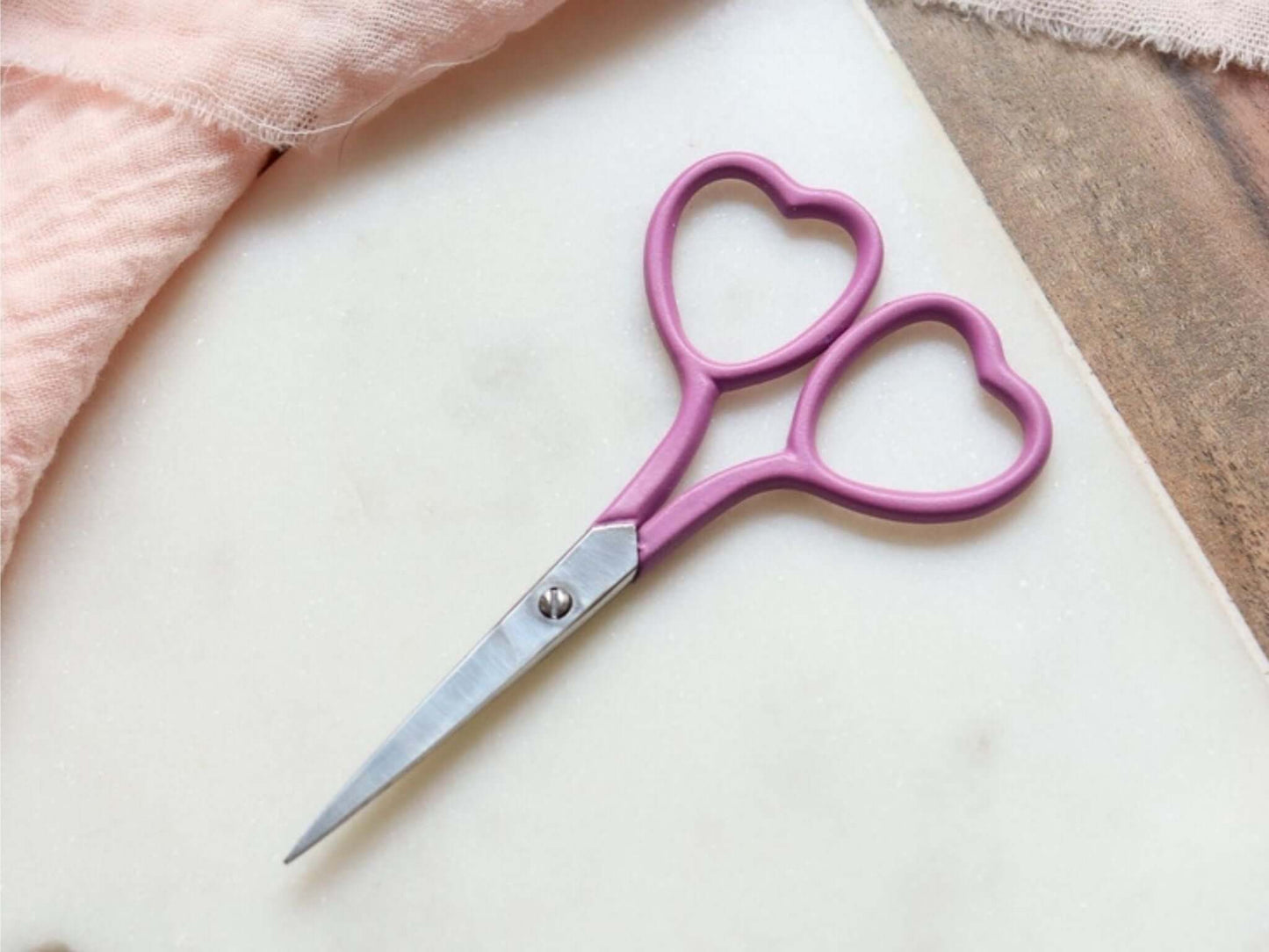 Heart shaped embroidery scissors in magenta pink